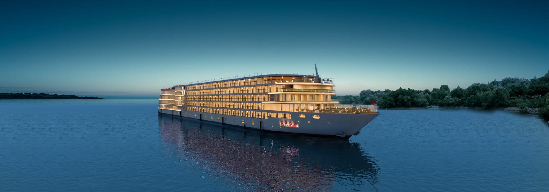 A river cruise vessel lit along her full length on still water at dusk