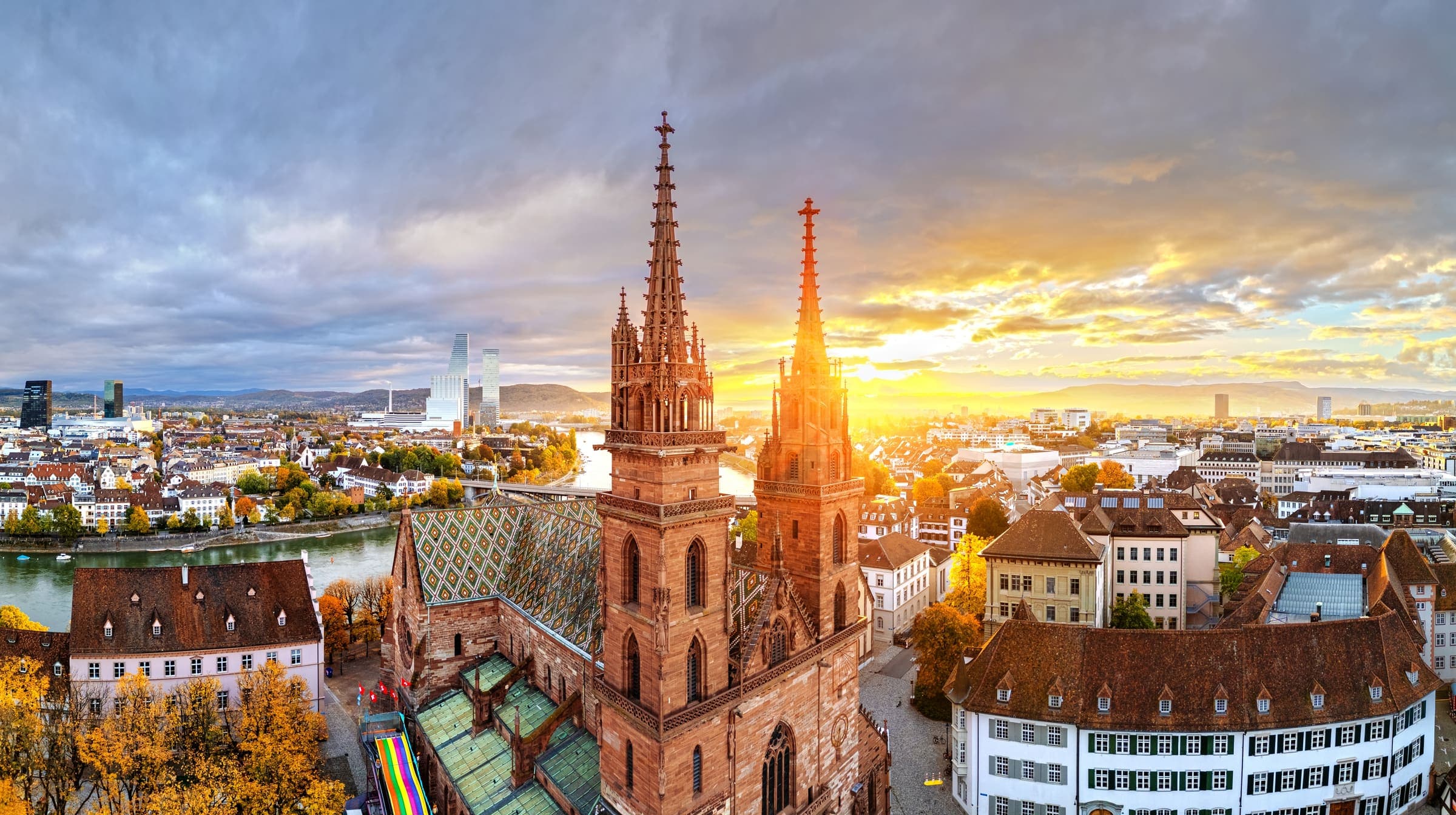 Basel at sunset, the Münster’s twin spires above the rooftops of the old town