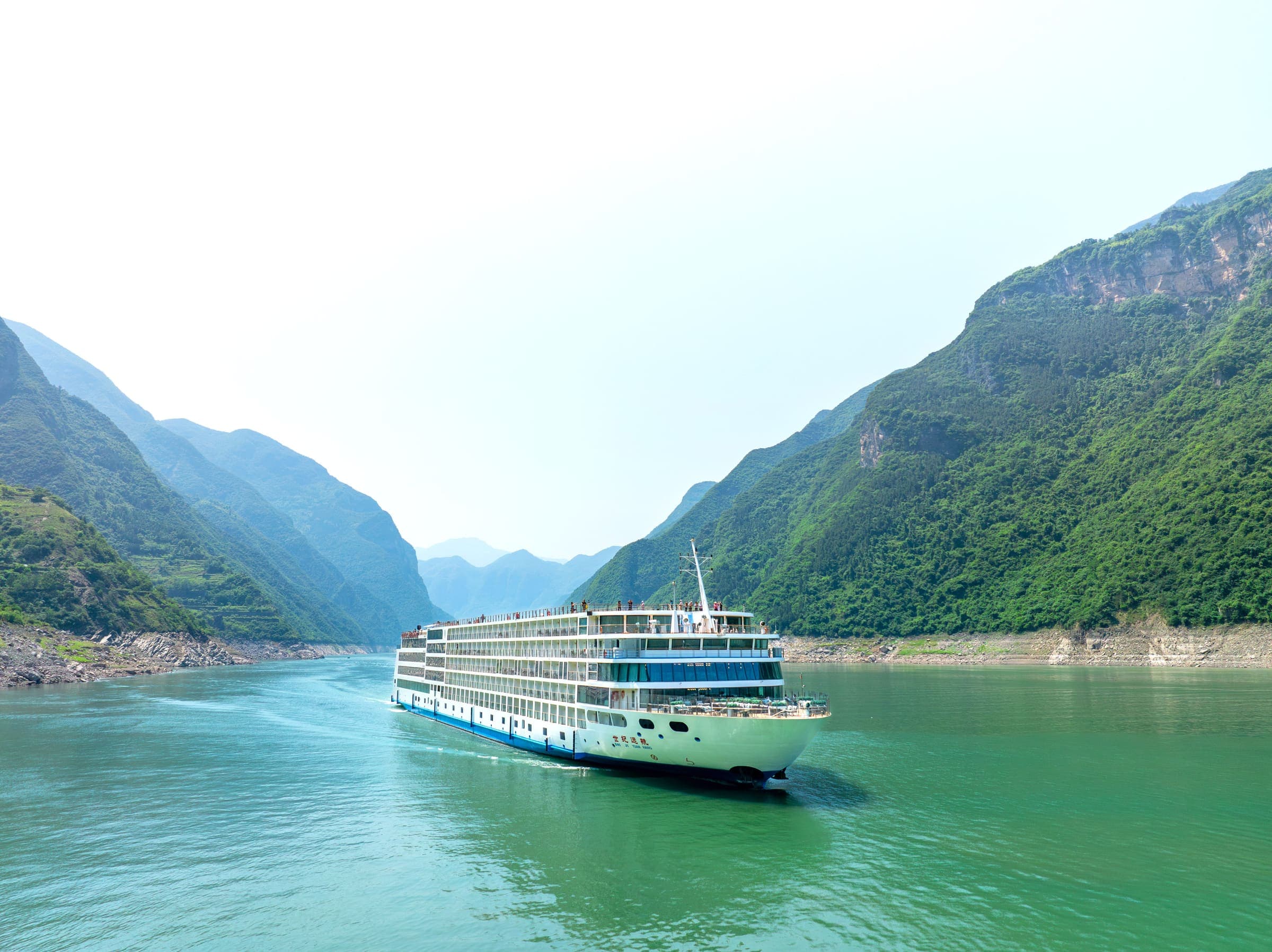 Century Voyage on the Yangtze in morning haze, the gorge narrowing ahead of her